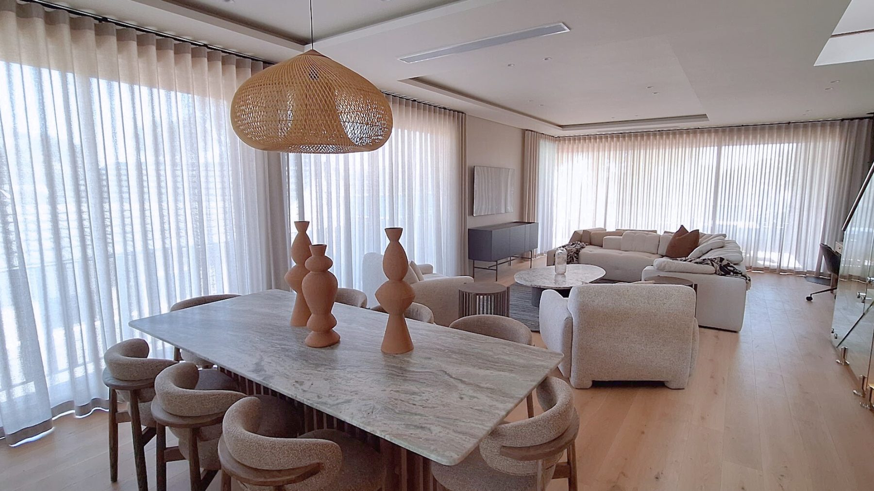 Sheer wave curtains — wide open-plan dining and lounge